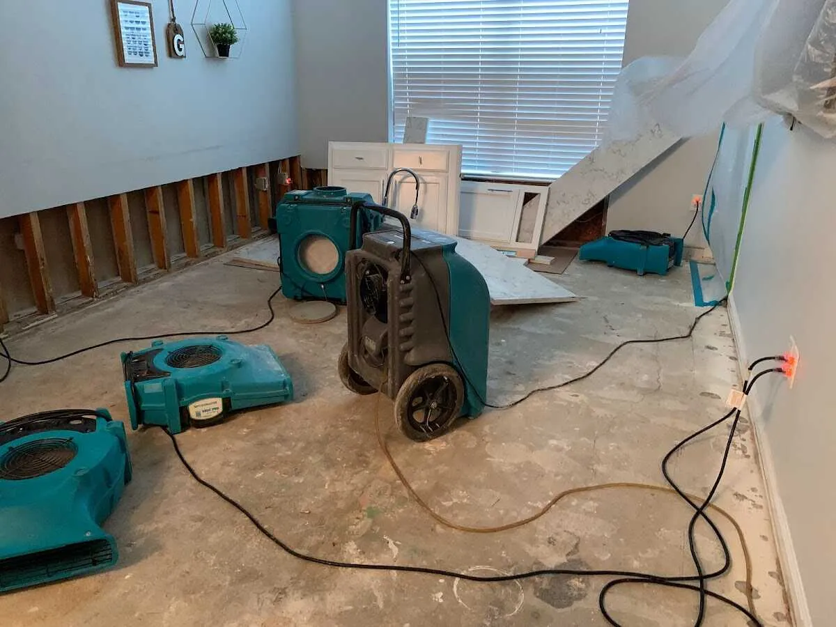 Dehumidifier in flood-cut room for Water Damage Restoration in Burlington